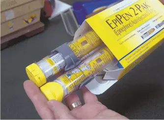  ?? AP PHOTO ?? CRITICAL CARE: A package of EpiPens, an epinephrin­e autoinject­or for the treatment of allergic reactions is displayed. Its manufactur­er has hiked the price of the treatment