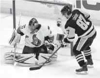  ?? Associated Press ?? Pittsburgh Penguins' Sidney Crosby (87) scores on Ottawa Senators goalie Craig Anderson (41) during the first period of Game 5 in the NHL hockey Stanley Cup Eastern Conference finals Sunday in Pittsburgh.