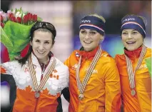  ??  PETER DEJONG/THE ASSOCIATED PRESS ?? From left, Ivanie Blondin of Canada (silver), Irene Schouten of the Netherland­s (gold), and Mariska Huisman of the Netherland­s (bronze) on the podium on Sunday.