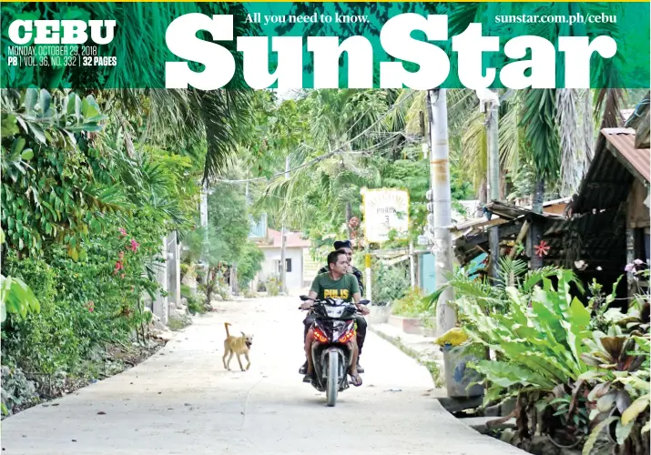  ?? SUNSTAR FOTO / ALEX BADAYOS ?? GHOST TOWN. Police patrol ground zero in Sitio Sindulan in Barangay Tina-an, City of Naga to make sure residents have not returned since they were forced to evacuate following the deadly landslide that struck the area last month.