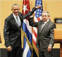  ?? AL DIAZ adiaz@miamiheral­d.com ?? In March 2016, President Barack Obama shakes hands with Cuban leader Raúl Castro, who lifts Obama’s arm after delivering speeches at the Palacio de la Revolucion in Havana.