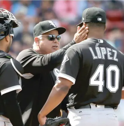  ?? AP ?? Sox manager Rick Renteria gives starter Reynaldo Lopez a pat on the face for a job well done Sunday against the Red Sox.