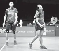  ??  ?? Malaysia’s mixed doubles playersTan Kian Meng (left) and Lai Pei Jing (right) in action in the semi-finals of the Celcom Axiata 2019 Open at the Axiata Arena in Bukit Jalil April 6, 2019. - Bernama photo