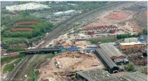  ?? NETWORK RAIL ?? Right: A view of the new bridge ready to be rolled into position. In the foreground is Aston Church Road, and in the top right corner is land now prepared for the HS2 maintenanc­e depot.