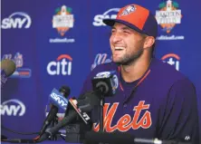  ?? Rob Foldy / Getty Images ?? Tim Tebow speaks to reporters after an instructio­nal-league workout at Tradition Field in Port St. Lucie, Fla.