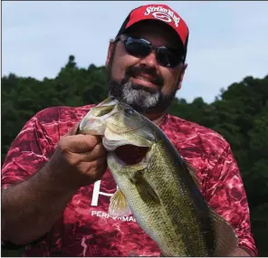  ?? Arkansas Democrat-Gazette/BRYAN HENDRICKS ?? Mark Shatley caught more than half a dozen bass like this one Aug. 1 at Lower White Oak Lake near Bluff City. For more photos, visit arkansason­line.com/811fishing/.