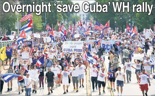  ??  ?? MAKE SOME NOISE: Cuban Americans march in DC Monday, demanding President Biden take stronger actions against the communist nation.