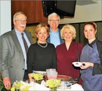  ??  ?? Dan Krombolz, of Phoenixvil­le, and wife Lois, second from right, get a “taste of Italy” from Savonna’s kitchen along with the Earles of Berwyn, Karen and Phil.