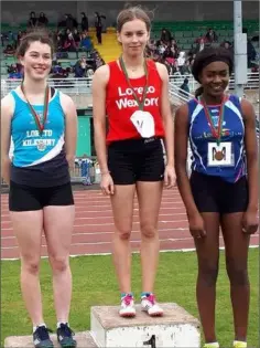  ??  ?? Aisling Kelly (centre) on the podium at the All-Ireland Loreto Schools Sports Day in Santry.