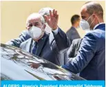  ?? AFP ?? ALGIERS: Algeria’s President Abdelmadji­d Tebboune waves as he departs after voting at a polling station in Bouchaoui, on the western outskirts of Algeria’s capital Algiers yesterday during the 2021 parliament­ary elections. —