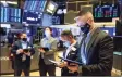  ?? Associated Press ?? Traders work on the floor of the New York Stock Exchange on Wednesday.