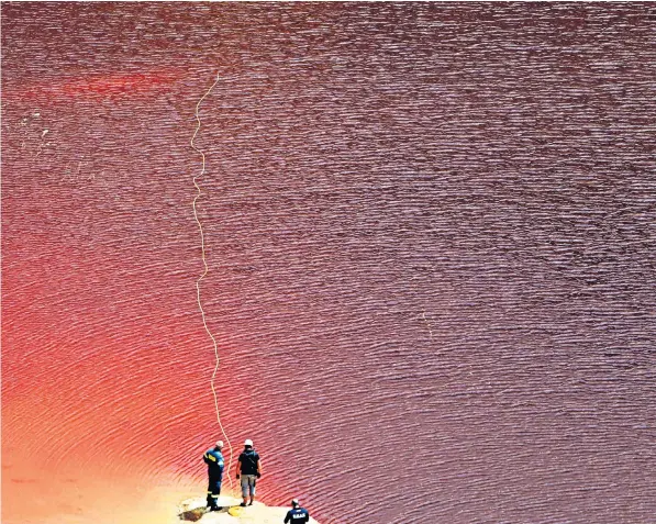  ??  ?? Police use an underwater camera to search the highly toxic lake, west of the capital Nicosia, for the suitcase after a Cypriot army officer confessed to killing five women and two children