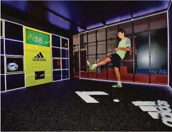  ?? Courtesy: Organisers ?? Al Wahda striker Sebastian Tagliabue takes a kick at the Adidas’ Speed of Light boot launch at the Dubai Sports World on Wednesday. Football enthusiast­s across the UAE can put their speed to the test till August 27 and earn a chance to compete in the...