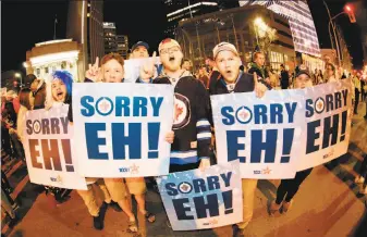  ?? John Woods / Associated Press ?? Jets fans celebrate the franchise’s first playoff series win after a 5-0 victory over the Wild. Winnipeg will face the Predators or Avalanche in the Western Conference semifinals.