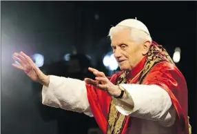  ?? Gabriel Bouys, Afp-getty Images ?? Pope Benedict XVI blesses participan­ts in the traditiona­l Good Friday Via Crucis (Way of the Cross) procession near the Colosseum in Rome.