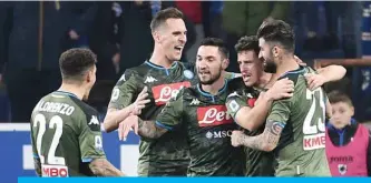  ??  ?? NAPOLI: Napoli teammates celebrate after scoring two late goals to beat Sampdoria.