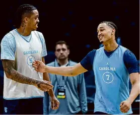  ?? Ronald Martinez/getty Images ?? North Carolina’s Armando Bacot, left, and Seth Trimble talk during practice day for the NCAA Tournament’s West Region at Crypto.com Arena in Los Angeles.