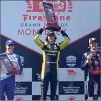  ?? (AP/Jenna Fryer) ?? Colton Herta (center) celebrates his IndyCar victory at Laguna Seca with runner-up Alex Palou (left) and Romain Grosjean on Sunday in Monterey, Calif. Palou stretched his lead in the championsh­ip standings to 35 points headed into next week’s season finale.