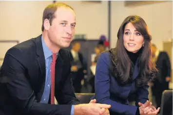  ??  ?? Paying tribute
Prince William and Catherine, Duchess of Cambridge