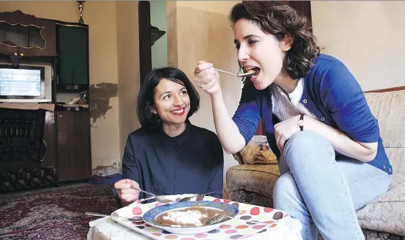  ??  ?? Cookbook authors Itab Azzam and Dina Mousawi spent time in Beirut refugee camps eating with Syrian refugees, and left with a tale of food and friendship. Half of the royalties from the sale of the their new book, Our Syria: Recipes from Home, are...