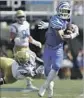  ?? Mark Humphrey Associated Press ?? MEMPHIS receiver Anthony Miller gives the slip to UCLA defensive back Denzel Fisher (25).