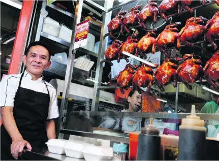  ?? Munshi Ahmed for The National ?? Hawker Chan says he feels pressure to retain the Michelin star for his food stall in the Chinatown Complex in Singapore, where customers queue every day for his legendary soya sauce chicken.