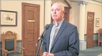  ?? PHOTO BY ASHLEY FITZPATRIC­K/THE TELEGRAM ?? Pleased to have a possible tentative agreement with CUPE, Tom Osborne takes questions from reporters in front of the House of Assembly at Confederat­ion Building Thursday.