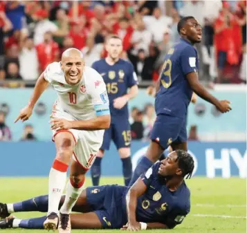  ?? ?? Tunisia’s Wahbi Khazri ( left) in ecstasy after scoring against France in the last group game… yesterday