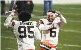  ?? Justin K. Aller / Getty Images ?? Baker Mayfield and Myles Garrett celebrate Cleveland’s wildcard win at Pittsburgh.