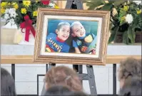  ?? THE CANADIAN PRESS/ANDREW VAUGHAN ?? A portrait of the young brothers rests on the altar at the funeral for Noah and Connor Barthe at St. Thomas Aquinas Roman Catholic Church in Campbellto­n, N.B. on Saturday, Aug. 10, 2013. The New Brunswick government is introducin­g new legislatio­n to...