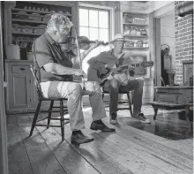  ?? CONTRIBUTE­D ?? A peek at the first virtual Highland Village Day Concert with Howie MacDonald on fiddle and Buddy MacDonald on guitar in the kitchen of the MacQuarrie-Fox House.