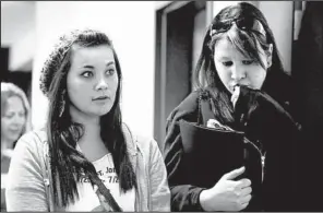  ?? AP/ED ANDRIESKI ?? Chantel Blunk
(left) leaves with a family member Monday after a preliminar­y hearing for James Holmes at the courthouse in Centennial, Colo. Blunk’s husband, Jon, was killed in the shooting.