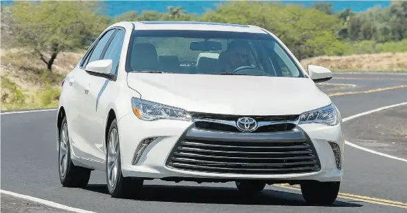  ?? HANDOUT/TOYOTA ?? From slimmed down headlights and handsome grille to its twin tailpipes, Toyota has greatly ramped up the Camry sedan’s road presence for 2015.