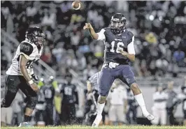  ?? ALLEN EYESTONE / THE PALM BEACH POST MEN’S BASKETBALL ?? Dwyer quarterbac­k Toddy Centeio threw four TD passes and ran for another score in Dwyer’s 40-3 victory Sept. 16 over Palm Beach Lakes.