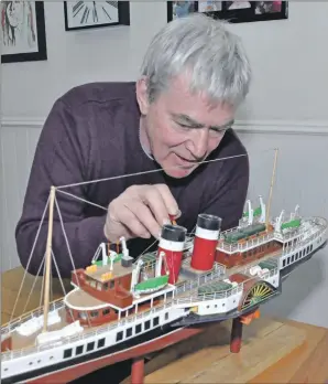  ?? 20_c12queenma­ry03 ?? David making some finishing touches to another of his models, the Waverley paddle steamer.