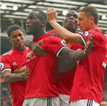  ?? AP ?? Romelu Lukaku celebrates a goal against West Ham United with his teammates during a Premier League match. —