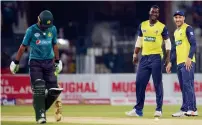  ?? AFP ?? World XI’s Darren Sammy (second right) celebrates with captain Faf du Plessis (right) after the dismissal of Pakistani batsman Fakhar Zaman during the third and final T20 match in Lahore. —