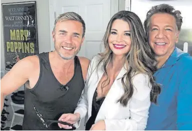  ??  ?? ▼ Take That songwriter Gary Barlow with Brianna and Ross King; left, Robbie Williams.