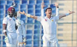  ??  ?? Yasir Shah makes a successful leg before wicket appeal against Darren Bravo.