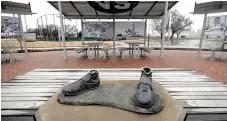  ?? ?? Thieves left just the feet of a bronze statue of Jackie Robinson at a park