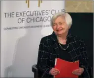  ?? CHARLES REX ARBOGAST — THE ASSOCIATED PRESS ?? Federal Reserve Chair Janet Yellen listens to her introducti­on before addressing the Executives’ Club of Chicago, Friday in Chicago. Yellen signaled that the Fed will likely resume raising interest rates later this month to reflect a strengthen­ing job...