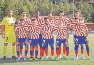  ?? // ATLÉTICO DE MADRID ?? El primer once del Atlético con la nueva camiseta