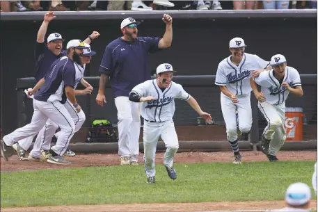  ?? PHOTO BY ROB WORMAN ?? La Plata coaches and players run from the dugout after the final out of the 4-1 victory over the Williamspo­rt Wildcats in the Class 2A state baseball championsh­ip game at Ripken Stadium in Aberdeen on Monday. It is the Warriors’ first state title since 2008.