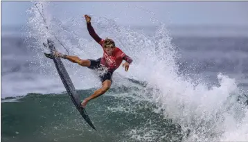  ?? PHOTOS BY MARK RIGHTMIRE — STAFF PHOTOGRAPH­ER ?? Gatien Delahaye of France surfs Saturday, the opening day of the U.S. Open of Surfing in Huntington Beach.