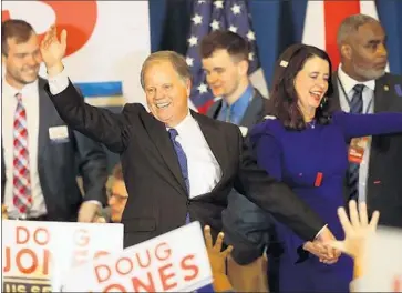  ?? Justin Sullivan Getty Images ?? D E M O C R AT Doug Jones celebrates his victory Dec. 12 in Birmingham, Ala. The special U.S. Senate election had a seriously flawed GOP candidate, but anxiety like that of Alabama’s voters has risen around the country.