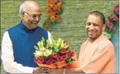  ??  ?? NDA presidenti­al candidate Ram Nath Kovind with Uttar Pradesh CM Yogi in Lucknow on Sunday.