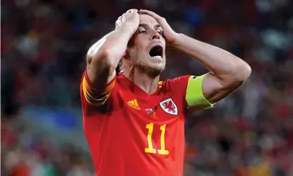  ?? Photograph: Nick Potts/PA ?? Gareth Bale is left in total disbelief after missing a chance for Wales against Estonia.