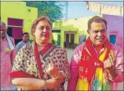  ?? ?? Former U.P. energy minister Shrikant Sharma and his wife after casting their votes at a polling station in Mathura.