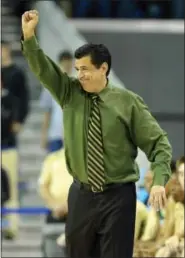  ?? MARK J. TERRILL — THE ASSOCIATED PRESS FILE ?? In this file photo, Sacramento State head coach Brian Katz gestures against UCLA. While coaches at schools like Duke, Kansas and Arizona had their eyes set on the elite, five-star players during the high school showcases, coaches at other low-major...