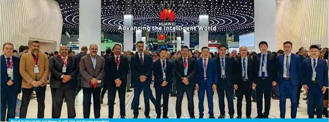  ?? ?? Nawaf Al-Gharabally and Steven Yi with Zain and Huawei executives.